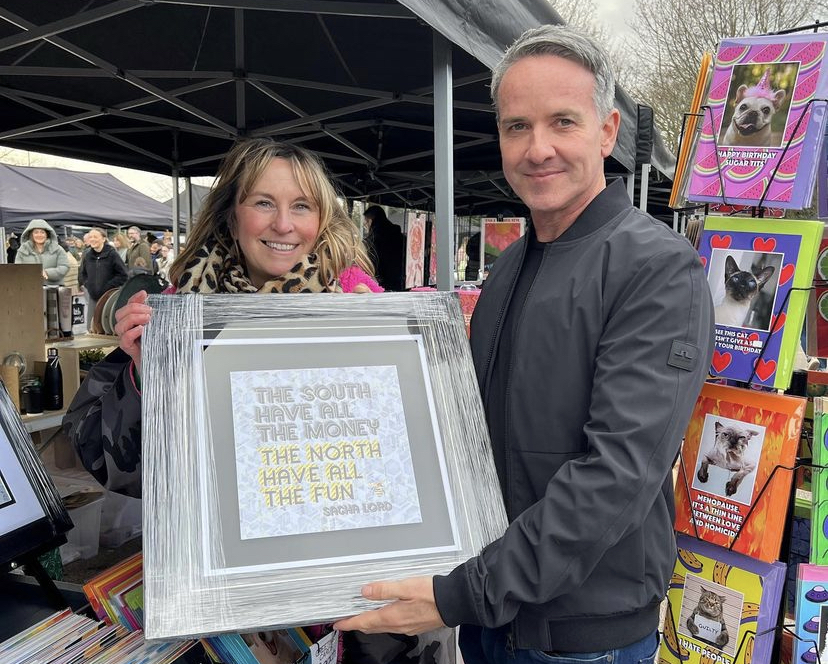 Sacha Lord with artist