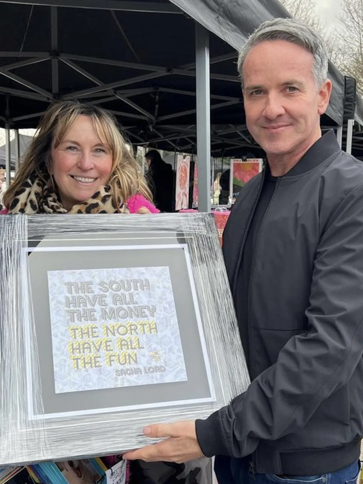 Sacha Lord with artist